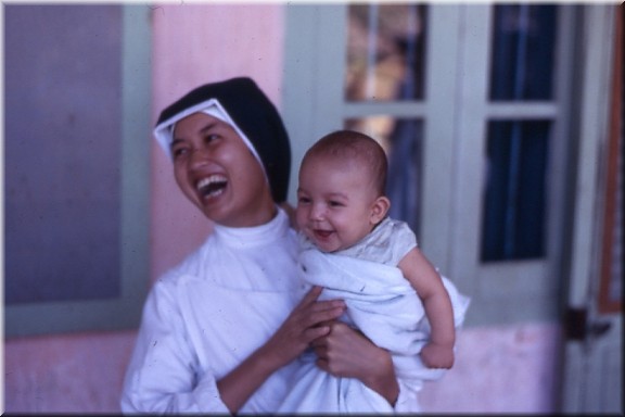 Baby & Nun at Vinh San Orphanage. Nha Trang.jpg